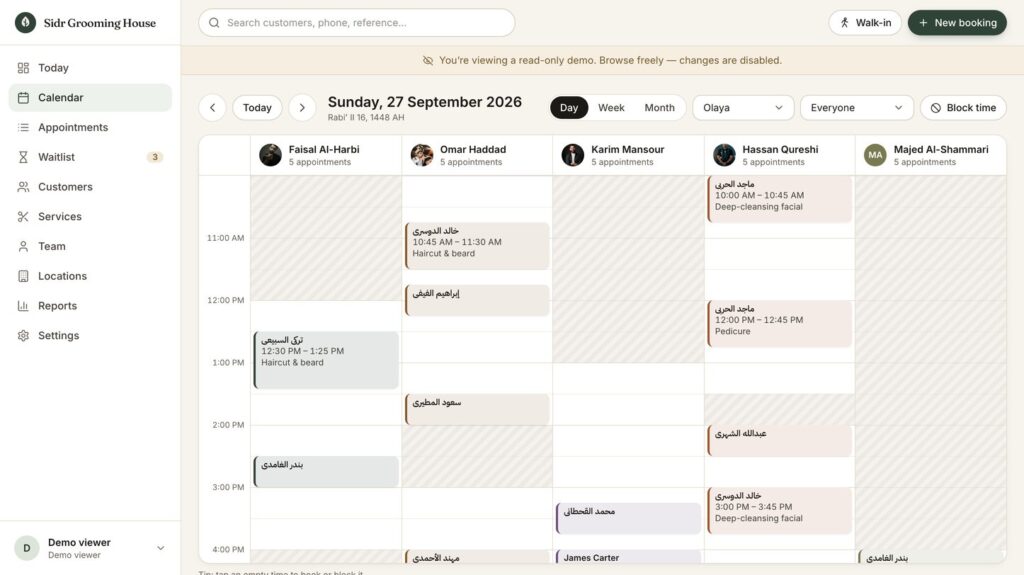 Day calendar with one column per specialist, appointment blocks and shaded time outside each shift